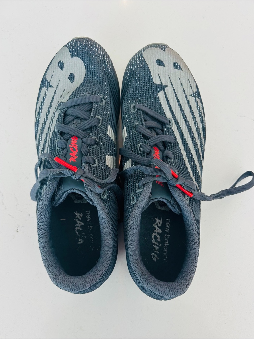 New Balance Men's Racing Shoes in Charcoal Gray with White and Red Accents